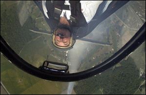 Pilot Bob Davis sees the world upside down as he puts his Russian-built Sukhoi SU-29 plane through its paces.