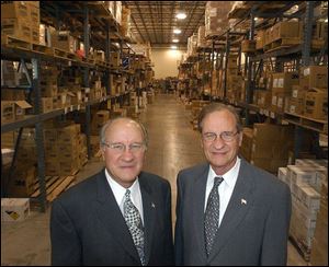 Tom Kellermeyer, left, and Don Kellermeyer serve customers in northwest Ohio, eastern Indiana, and southeast Michigan. Their company distributes thousands of products from this Bowling Green warehouse, built in 1994.