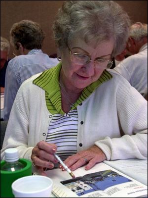 Pauline Harrell works through material during the class, held at Flower Hospital.
