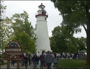 Fans of the Marblehead Lighthouse await their turn to climb the 77 steps and view Lake Erie and Cedar Point amusement park. Yesterday's festival was the last chance till spring to visit the interior of the tower at Marblehead Lighthouse State Park. It is the oldest continually operating lighthouse on the Great Lakes.