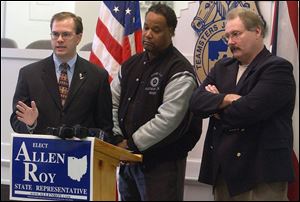 Allen Roy, left, is joined by Kenny Smith, center, Community Action Program chairman for United Auto Workers Local 12, and Bill Lichtenwald, president of Teamsters Local 20, at a news conference. Mr. Roy, a Republican, is seeking the Ohio House District 47 seat.