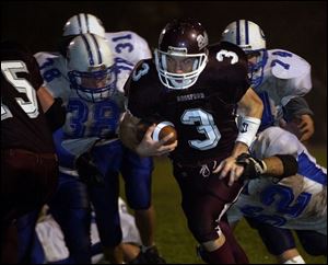 Rossford's Josh Heidebrink scores a touchdown against Anthony Wayne's Billy Benner (38), Tim Babcock (74) and Jordan Ulrich (62). Rossford won its first NLL title since 1990.