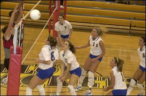Emily Florian, front center, attempts to set as her St. Ursula teammates, Sara Holtz (8), Brittany Fox (7), Sarah Florian (11), Laura Fender (1) and Colleen Slattery (5), look for the ball. The Arrows defeated Central Catholic in the district championship.