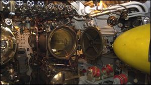 The forward torpedo room of the USS Cod shows how narrow the interior of World War II-era submarines were, measuring in this instance only 16 feet across.