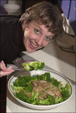 Jill Roman prepares vermicelli with pork and broccoli.