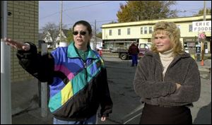 ‘It's going to take years' to revitalize Galena Street, says Rebecca Rumpf, left, pointing out some of the changes in the neighborhood with Kathy Kaufman of the Central City Main Street committee.