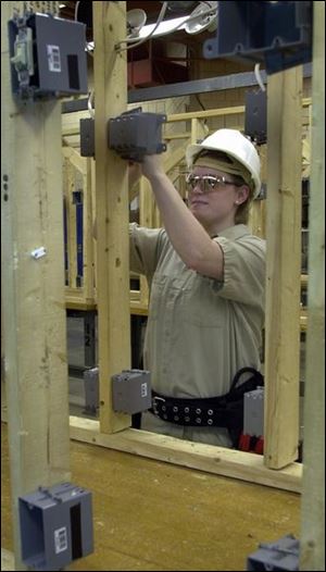 Amanda Perlewitz, 17, works on a residential stud wall in her class at Penta Career Center.
