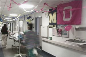 Maize-and blue coexists with scarlet-and-gray on the seventh floor of Toledo Hospital.