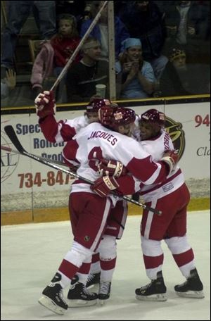 Toledo's Alexandre Jacques (9) celebrates scoring a goal with Storm teammates Dale Junkin, left, and Nathan Robinson.