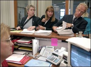 Toledo attorney Catherine Hoolahan, left, SNAP President Barbara Blaine, and attorney Jeffrey Anderson file lawsuits.
