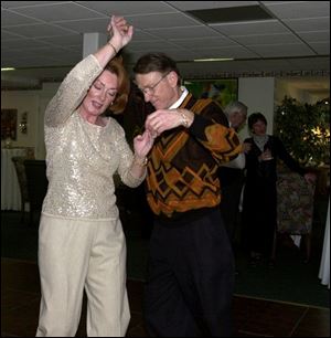 Sue and Chuck Vrooman dance at the Cauffiels' party, which raised funds for a tutoring organization.