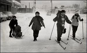 Getting around in Toledo's Colony area near Monroe and Oatis streets was easier when skis and sleds were used.