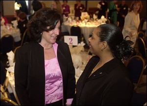 BENEFIT: Mary Martin, chairman, and Lisa McDuffie, CEO of the YWCA, attend the Hilton Hotel luncheon.