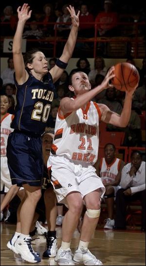 Francine Miller goes to the basket against Toledo's Kelly Walker. Miller led Bowling Green (10-10, 3-6 MAC), which ended a four-game losing streak, with 23 points. Walker scored 16 for UT (15-6, 8-2).