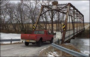 A five-ton weight limit ensures that nothing bigger than a small delivery truck will cross the Bradner Road bridge, erected in 1899.