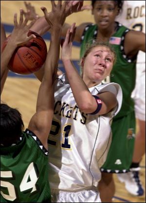 Toledo's Karen Hoogendam is closely guarded by Ohio's Tiffany Byrd. The Rockets are 17-6, 10-2 in the MAC.