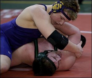 Maumee's Brett Boggs pins Seth Sharp of Beloit West Branch in their 275-pound match in the Division II semifinals. Boggs will face Galion's Dustin Fox today for the state championship. Boggs lost to Fox in the district.