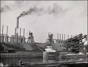An ore carrier sails up the Cuyahoga River past the Republic Steel Corp. plant in Cleveland in 1949.