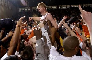 BG students hoist Cole Magner after the victory. Magner, also a football player, played a key role in upsetting Miami.