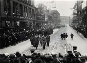 Returning troops parade down St. Clair Street from Adams Street toward Madison Street in Toledo on April 10, 1919.