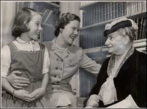 In this 1955 photo, Olive Colton, right, a suffragette and founding member of the League of Women Voters, chats with Martha Miller and her mother at a meeting of the Toledo District Nurse Association.