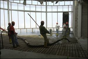 Concrete is poured on the second level of the 90,000-square-foot office portion of the complex.