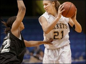 Toledo's Karin Hoogendam is guarded by a Marshall player in the first round of the Mid-American Conference tournament. She had 10 points and 9 rebounds in 19 minutes of play.