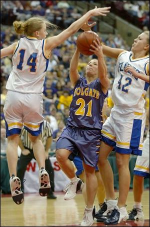 Holgate's Vanessa Rothman, who scored 10 points, slices between Marion Local's Maria Moeller, left, and Margo Moeller.