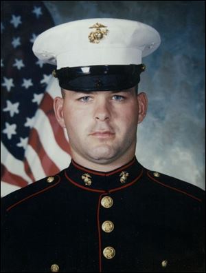 Cpl. Lance Kokensparger sustained a broken neck in an auto accident in 2001.