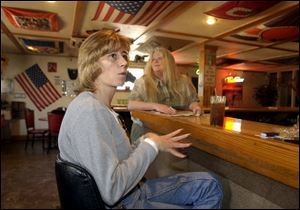 `I have a lot of friends out there; they have a lot of time invested,' says Nadene Gerencser, with Karen Lee, in the background, owner of Karen's ParkStation Bar & Grill in Antwerp. Ms. Gerencser has worked four years at the plant.