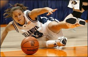 Villanova junior Courtney Mix, a Central Catholic graduate, falls to the floor attempting to get the ball. She had 15 points and a team-high 12 rebounds as the Wildcats beat Colorado.