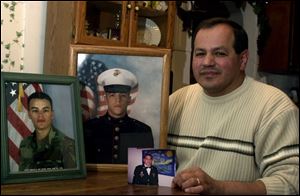 Rey DeLeon, Jr., has three sons in the U.S. military, from left: Craig, 21; Rey III, 19, and Jamie, 23. His older sons, both in the Army, will soon go to Iraq, and his youngest son, a Marine, may go as well.