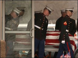 Marines carry Pvt. Juan Garza's casket in Temperance, Mich.