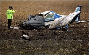 Ohio State Trooper Kevin Miller investigates the crash of a small plane at Fulton County Airport. 