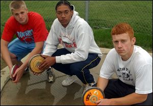 From left, Bowsher's Keith Dankert, Whitmer's Darnell Randolph and Northview's Andrew Nicholas gave Toledo a discus sweep at the regional meet. But what about state?