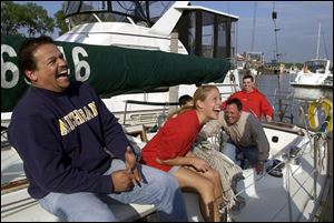 LAUGHS ON THE LAKE: Having a blast aboard the Irish Mist, a 41-foot Morgan, are, from left, Moustafa El Baradie, Laura Jelsone, Gary Williams, and Jasen Hager, all members of the Detroit Edison Boat Club.