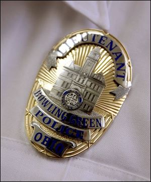 The badge commemorates the department's 100th year.
