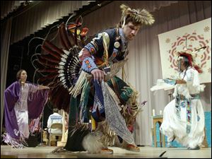 Iliana Nequah Armega, Suart H. Engler, Jr., and Calvin Yashie Hill, from left, perform a traditional dance during the ceremony of `reconciliation and hope' held in Lakeside.
