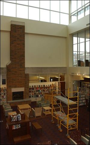 The library was closed for more than a year for a $5.7 million renovation and expansion project that included replacing its flat roof with one that is pitched.