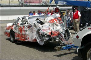 This mangled mass of metal is Brett Bodine's car after yesterday's crash in practice.