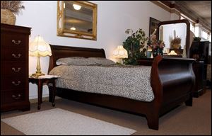 A suite of bedroom furniture is among the imports from China at the Shea's store on Lagrange Street in Toledo.