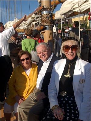 ABOARD THE APPLEDORE IV: From left, Mary and Howard Madigan and Jean Smith at Toledo Club party.