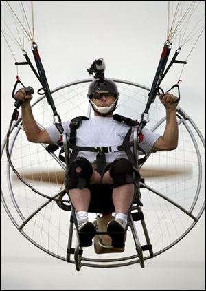 John Phillips of Reading, Pa., does a low-level flyover as he videotapes his flight with a helmet-mounted camera. 