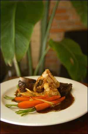 Braise short ribs with organic vegetables from the Diva kitchen.