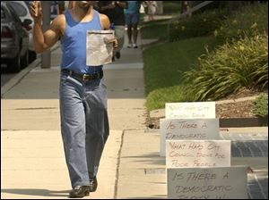 cty protest21p 1 August 21, 2003. Danny Clark of Fresh Attitude, Inc., protests the unfair distibution of funds to the minority Alcohol and Drug Treatment Centers at One Government Center Thursday afternoon. Blade photo by Jeremy Wadsworth