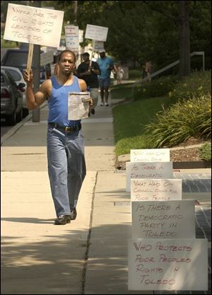 cty protest21p 1 August 21, 2003. Danny Clark of Fresh Attitude, Inc., protests the unfair distibution of funds to the minority Alcohol and Drug Treatment Centers at One Government Center Thursday afternoon. Blade photo by Jeremy Wadsworth