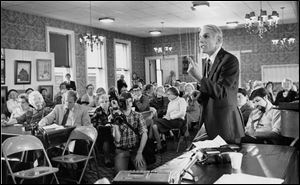 Lloyd Colenback voices concerns at a local church in November, 1982, about the Portside Festival Marketplace. Later, in the 1990s, Mr. Colenback matched his enthusiasm with another strong supporter of downtown, Mayor Carty Finkbeiner.