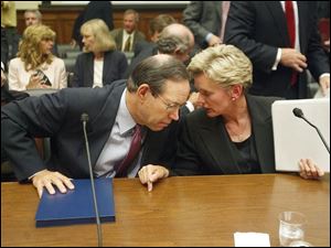 Ohio Gov. Bob Taft and Michigan Gov. Jennifer Granholm confer after appearing before a House panel in Washington.