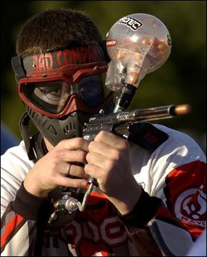 A paintball leaves Colby Gallagher's gun. His team, Bad Company, is based out of Washington, D.C.