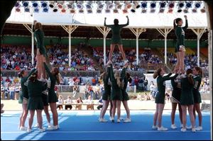 Cheerleaders from Christi Catholic High School in Jackson, Mich., perform during the cheerleading competition. 